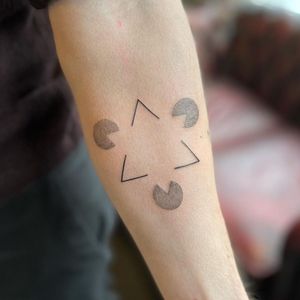 Elegant fine line triangle pattern inked on forearm by tattoo artist Chris Harvey.