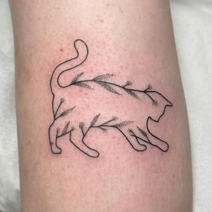 Elegant arm tattoo featuring a dotwork cat and fine line sprig design, professionally done in London, GB.