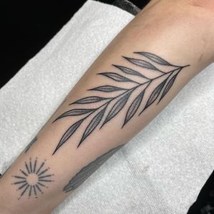 Beautifully detailed fine line floral illustration by Chris Harvey on your forearm