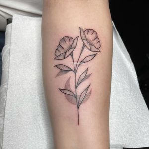 Elegant fine line tattoo of a beautiful flower design on the forearm, expertly done in dotwork style by artist Chris Harvey.