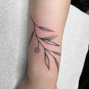 Unique blackwork and dotwork design by Chris Harvey, combining fine line details for a stunning leaf motif on the forearm.