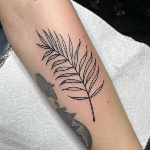 Elegant and detailed sprig design by Chris Harvey, perfect for a sleek forearm tattoo. Illustrative style with fine line details.