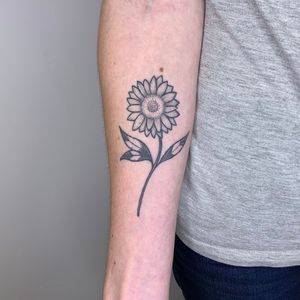Elegant and intricate dotwork design by Chris Harvey featuring a beautiful sunflower motif on the forearm.
