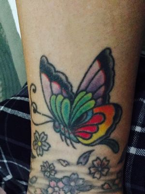 Flower ankle bracelet was my very first tattoo. The butterfly was added a little later. 