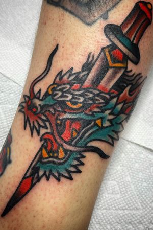 #Dragon and #dagger. Done at Greenhouse in Asheville, NC, USA. Email info@greenhouseavl.com for appointments. #dragontattoo #traditional #traditionaltattoo
