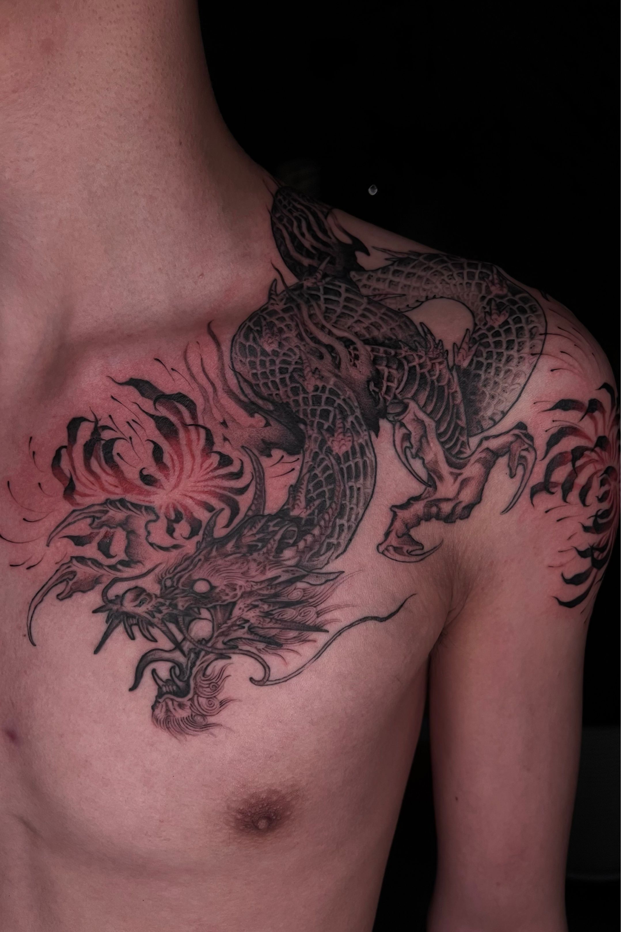 Red spider lily tattoo on the left side ribcage