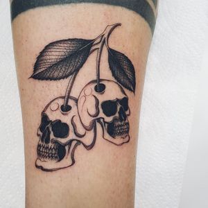 Get a bold and unique black and gray design featuring a skull and cherry motif. Located in London, GB.