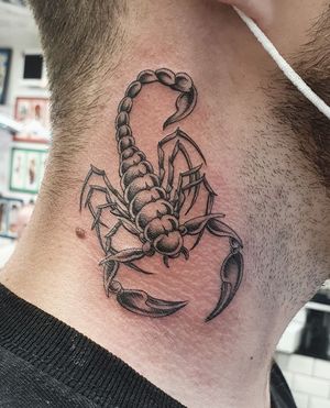 Get a striking blackwork scorpion tattoo on your neck, beautifully illustrated by the talented artist Dani Mawby.