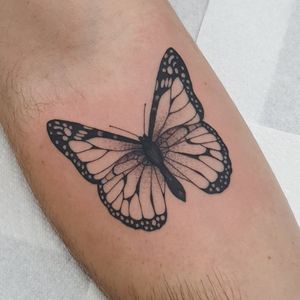 Beautiful blackwork butterfly tattoo design by Dani Mawby, perfect for your forearm. Make a statement with this stunning piece!