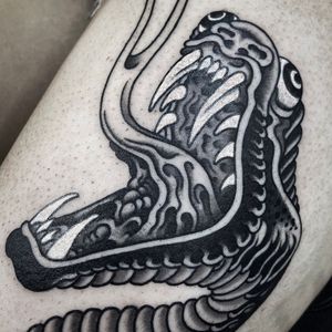 Experience the fusion of Japanese and neo-traditional styles with a striking snake design on your upper leg in London.