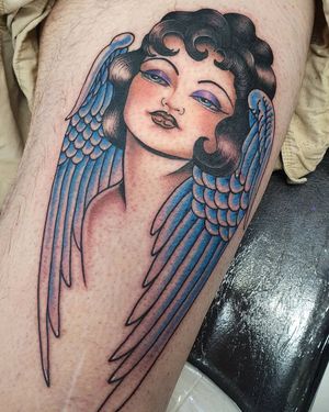 Celestial beauty embodied in Dani Mawby's stunning illustrative design on upper leg, featuring angelic wings and a serene woman. Perfect harmony of tradition and innovation.