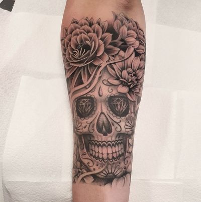 Artist Dani Mawby's intricate design features a stylish spin on the traditional sugarskull motif in a chicano style.