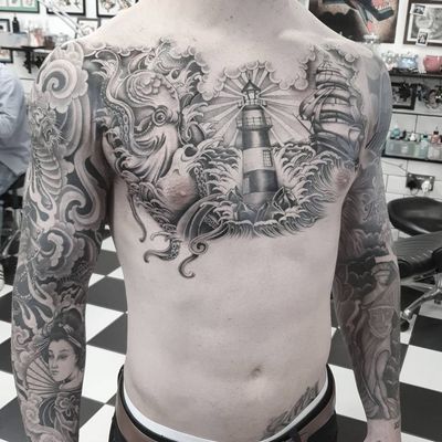 A stunning black and gray tattoo featuring an octopus, lighthouse, ship, geisha, and waves, expertly done by Dani Mawby.