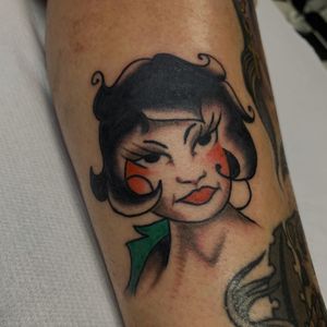 Get a classic traditional woman tattoo on your arm at a top studio in London, GB. Timeless and stunning design!