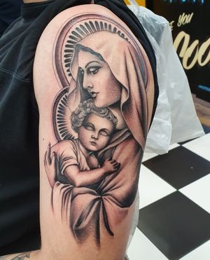 Get a stunning religion-inspired chicano mary tattoo on your arm in London. Embrace the beauty of faith with this intricate design.