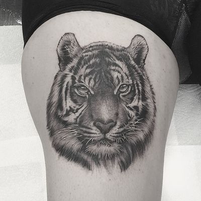 Get bold and fierce with this blackwork tiger tattoo by Dani Mawby, perfectly placed on your upper leg.
