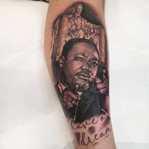 Celebrate MLK's legacy with a stunning blackwork realism piece on your lower leg by Dani Mawby.