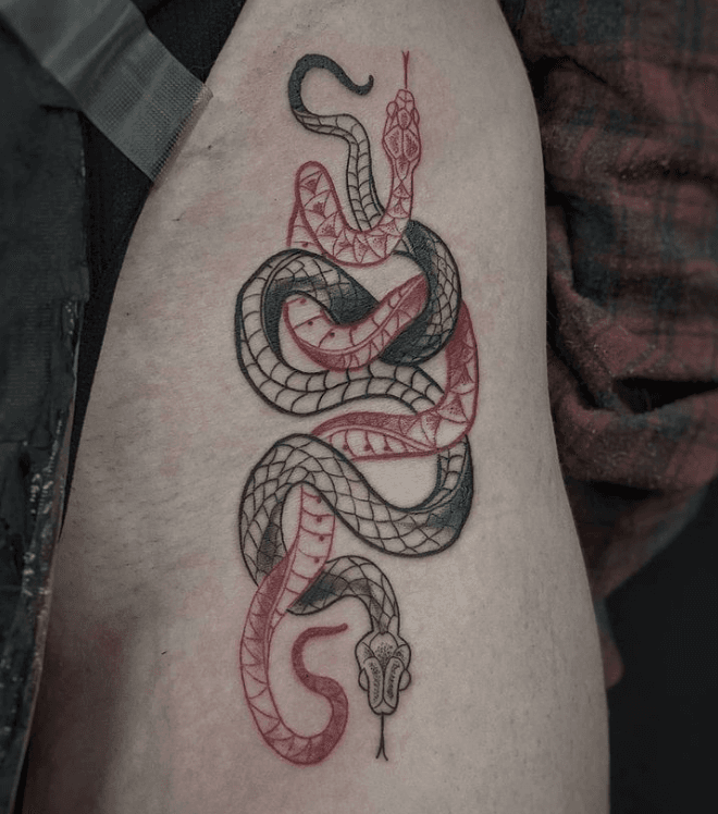 Fine line red snake tattoo on the foot