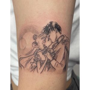 Adorn your upper arm with this exquisite kiss motif by tattoo artist Michaelle Fiore. A stunning addition to your anime collection.