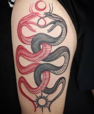 Get an illustrative snake tattoo on your upper arm in London, GB. Embrace the mystical and powerful symbolism of the serpent.