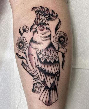 Embrace the beauty of traditional Japanese art with a stunning bird and flower tattoo on your lower leg in London.