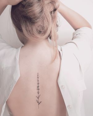 So simple, but so very delicate lavender tattoo. ....#finelinetattoo #finelinefloraltattoo #floral #floraltattoo #botanicaltattoo #delicate #ink #backtattoo #spinetattoo #backtattoo #minimalistic