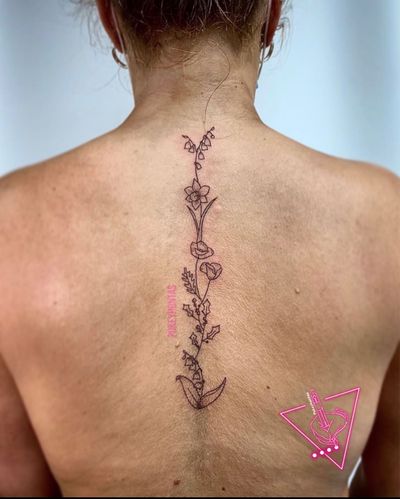Hand-Poked Floral Spine Tattoo by Pokeyhontas at KTREW Tattoo - Birmingham UK #spinetattoo #floral #daffodiltattoo #hollytattoo #back #fineline #tattoo #tattoos 