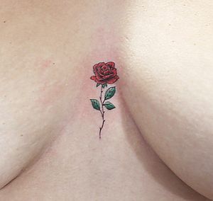 Tiny rose sternum tattoo