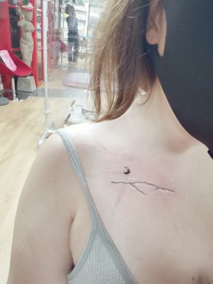 Sibling tattoo of Welsh mountain outline and half moon design