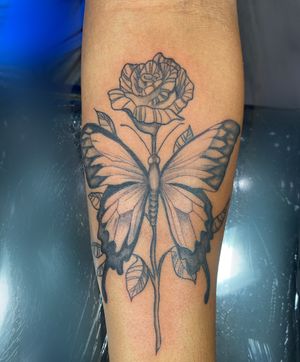 Butterfly and simple rose done at Enigma Tattoo Beverly Hills