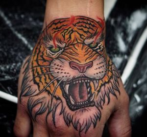 #handtattoo #tigertattoo by @tattoomarcel