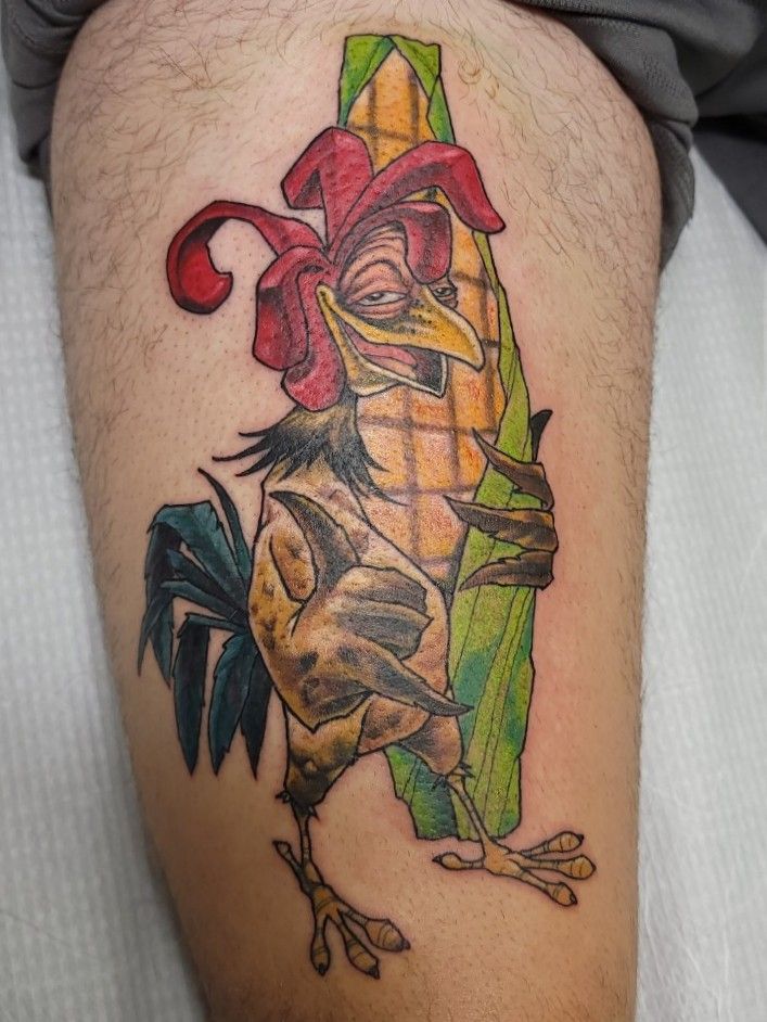 Chicken Joe from Surfs Up tattooed on the upper arm