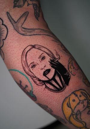 Embrace the dark with this illustrative Lady Gaga tattoo by Miss Vampira. Featuring a haunting combination of cigarettes, blood, and a mysterious woman. Perfect for the arm.