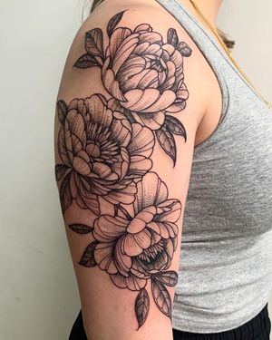 Embrace the beauty of a blackwork peony tattoo, handcrafted in New York for a striking illustrative style.