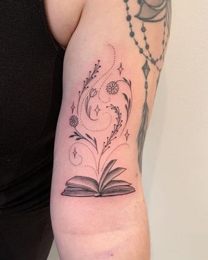 Exquisite book design on upper arm by top artist in New York. Perfect blend of fine lines and illustrative style.