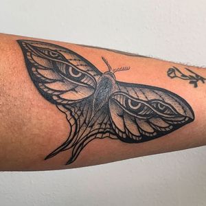 Get a stunning blackwork moth tattoo on your forearm in New York for a bold and unique look. Expertly designed and executed in an illustrative style.