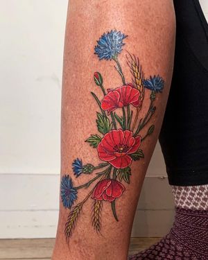 Get a vibrant and detailed flower tattoo in a neo-traditional style for your lower leg in New York, US.