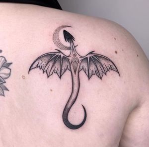 Get a unique dotwork dragon tattoo on your shoulder in London, GB for a bold and intricate design.