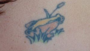 here is the frog on my mom's shoulder who made it during the erotic fair