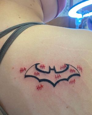 Batman symbol with Jokers laugh from my first day of tattooing