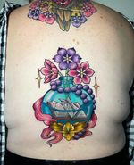 This is a coverup I did! #neotraditional #backyattoo #booktattoo #watertattoo #glass #book 