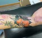 Orange and floral tattoo 