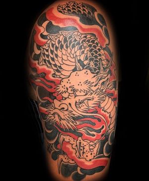 Get a stunning Japanese illustrative dragon tattoo on your upper arm from a top artist in Miami, US.