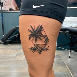 Capture the essence of Miami with this blackwork illustrative tattoo featuring a moonlit beach scene on your upper leg.
