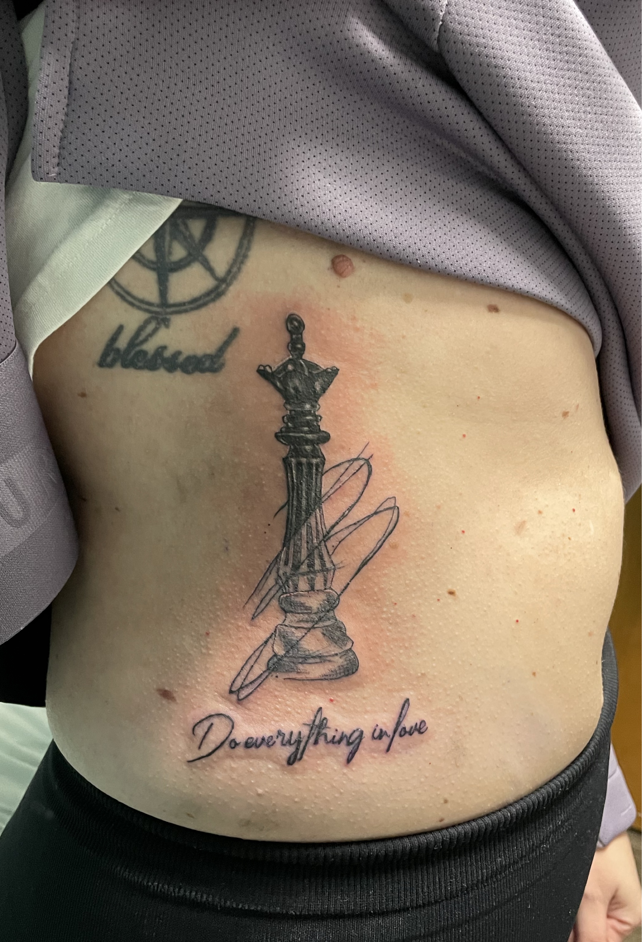 Matching king and queen chess pieces tattooed for