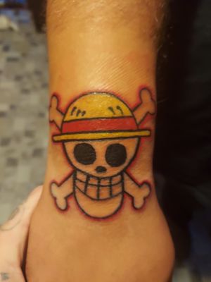 One Piece tattoo on right hand