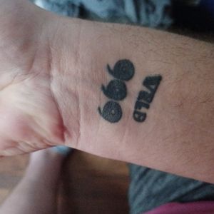 Juice Wrld memorial tattoo on right wrist