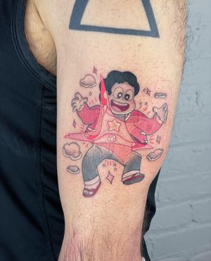 Get a vibrant new-school style tattoo of Steven from Steven Universe on your upper arm by artist Galen Bryce.