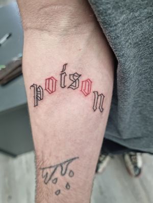 Poison lettering tattoo on forearm