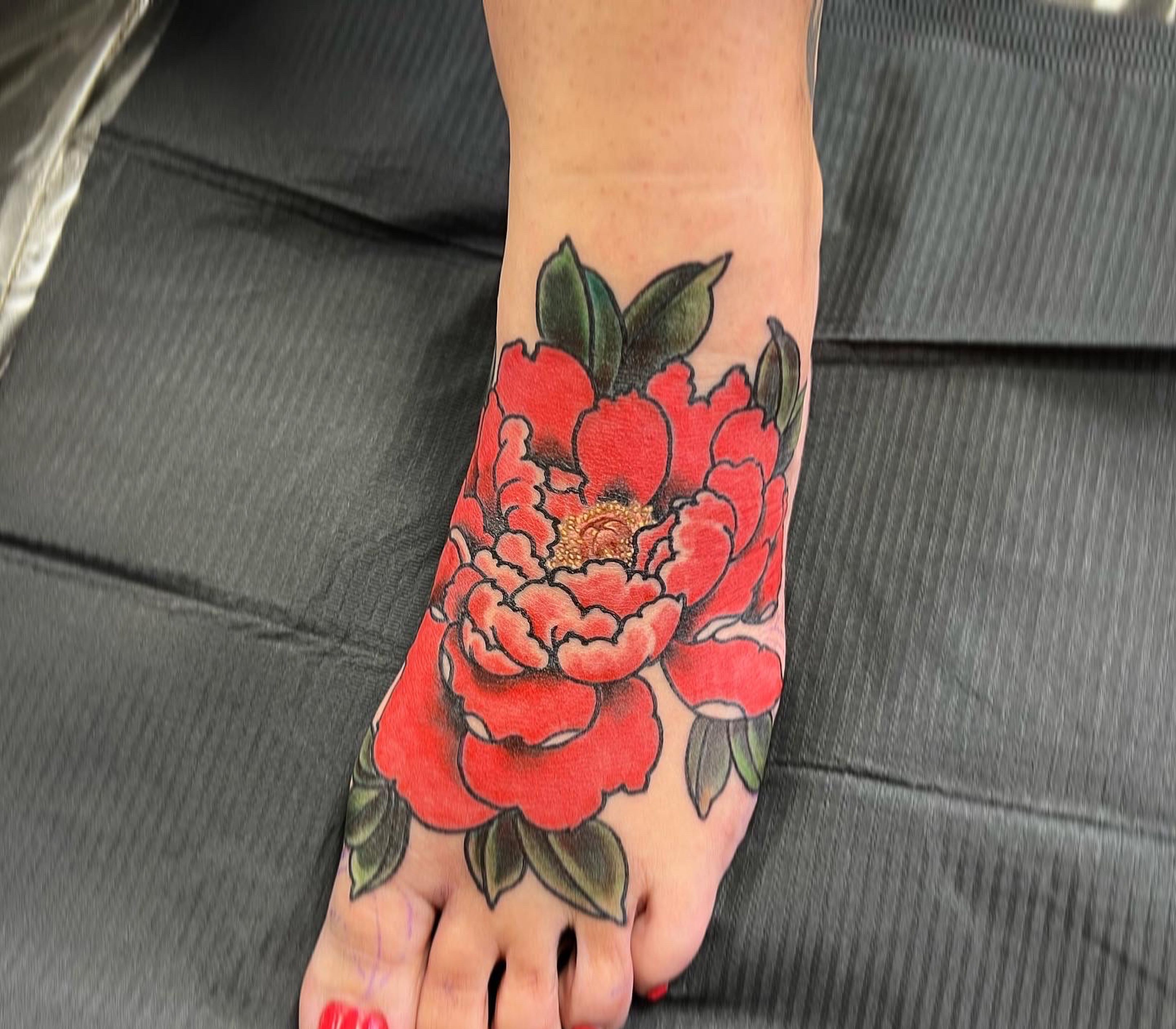 Flower tattoo on the foot - Tattoogrid.net